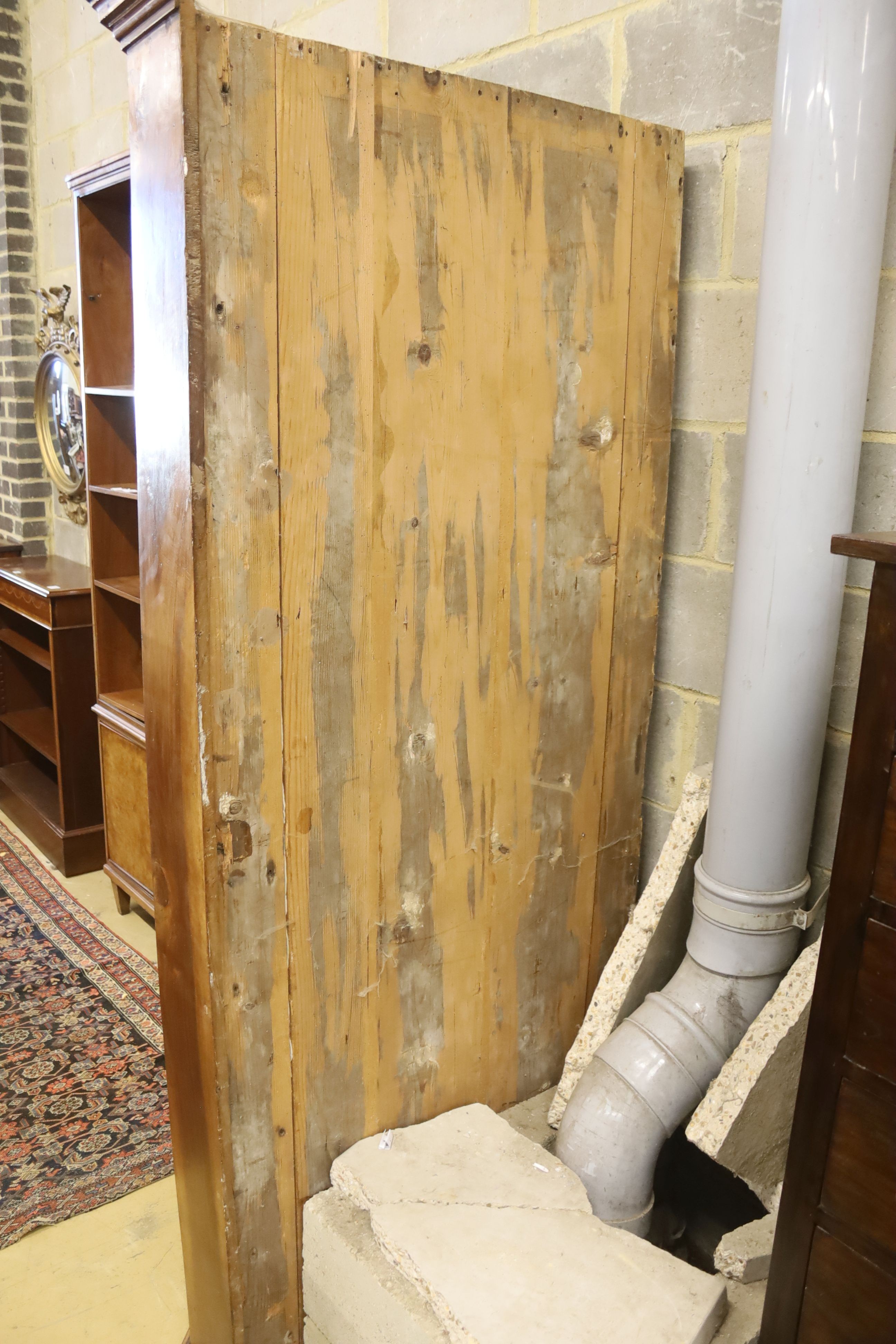 An 18th century North Italian walnut standing corner cupboard with concave door, width 130cm, depth 88cm, height 210cm